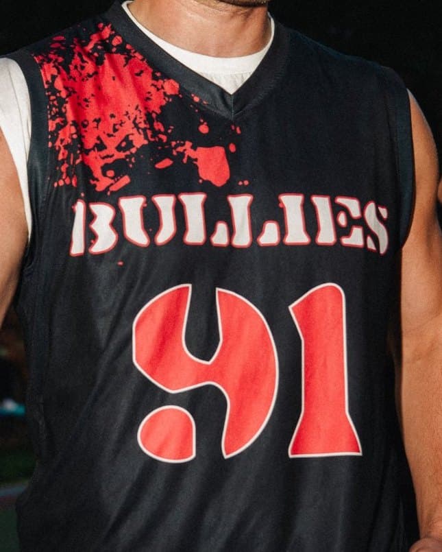 Close-up of the Bullies jersey: red splatter on the shoulder, stencil BULLIES lettering and a red 91